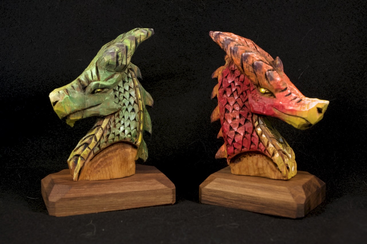 Wood Carving of two dragons. Done in Basswood with Walnut Bases, and finished with oil paint.